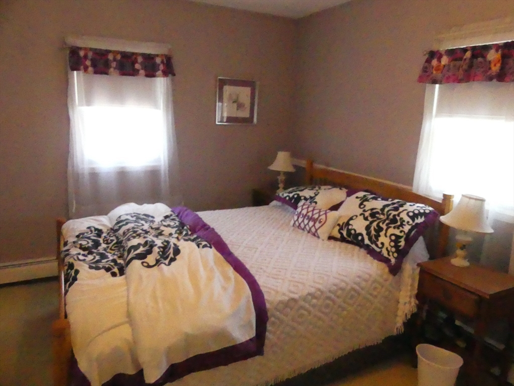 52 Ellsworth Avenue Beverly, MA 01915 - Photo 12 of 24 a bedroom with a bed and a window