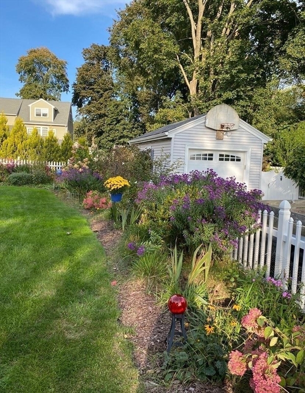 52 Ellsworth Avenue Beverly, MA 01915 - Photo 15 of 24 a front view of a house with a yard and fountain