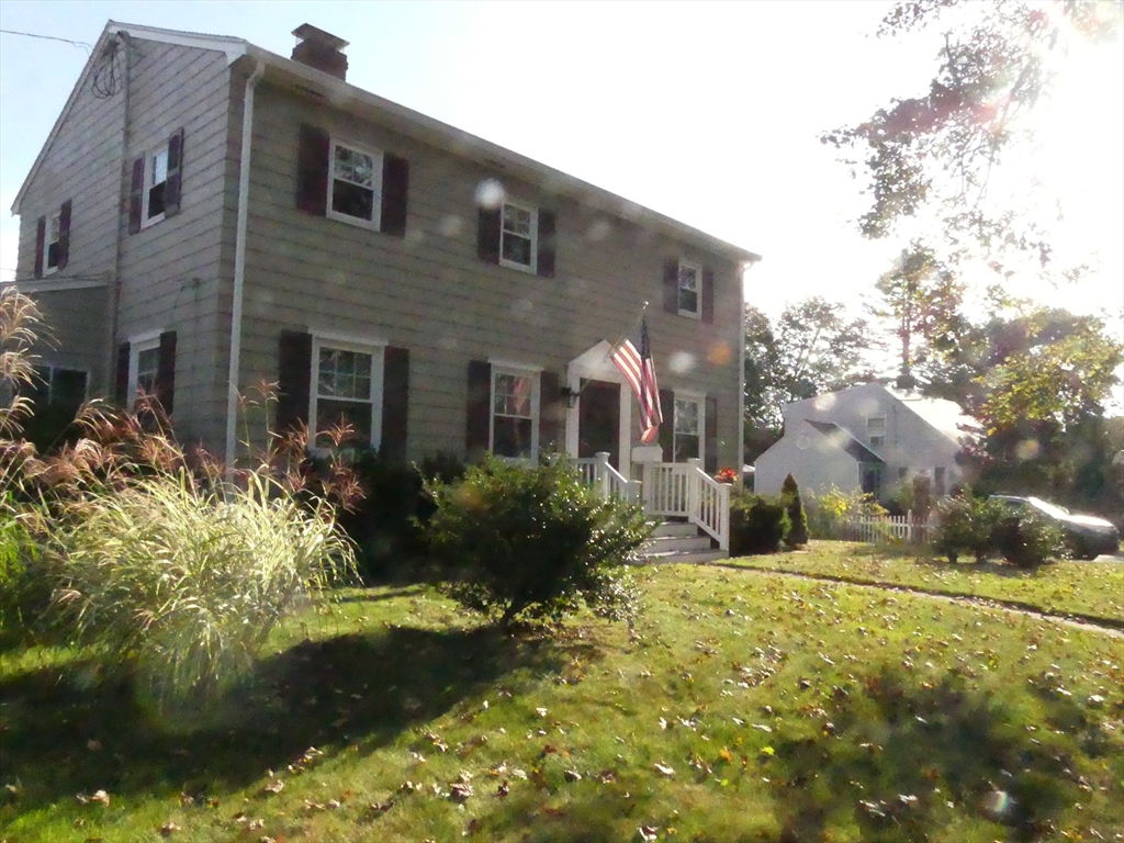 52 Ellsworth Avenue Beverly, MA 01915 - Photo 2 of 24 a front view of house with yard and green space