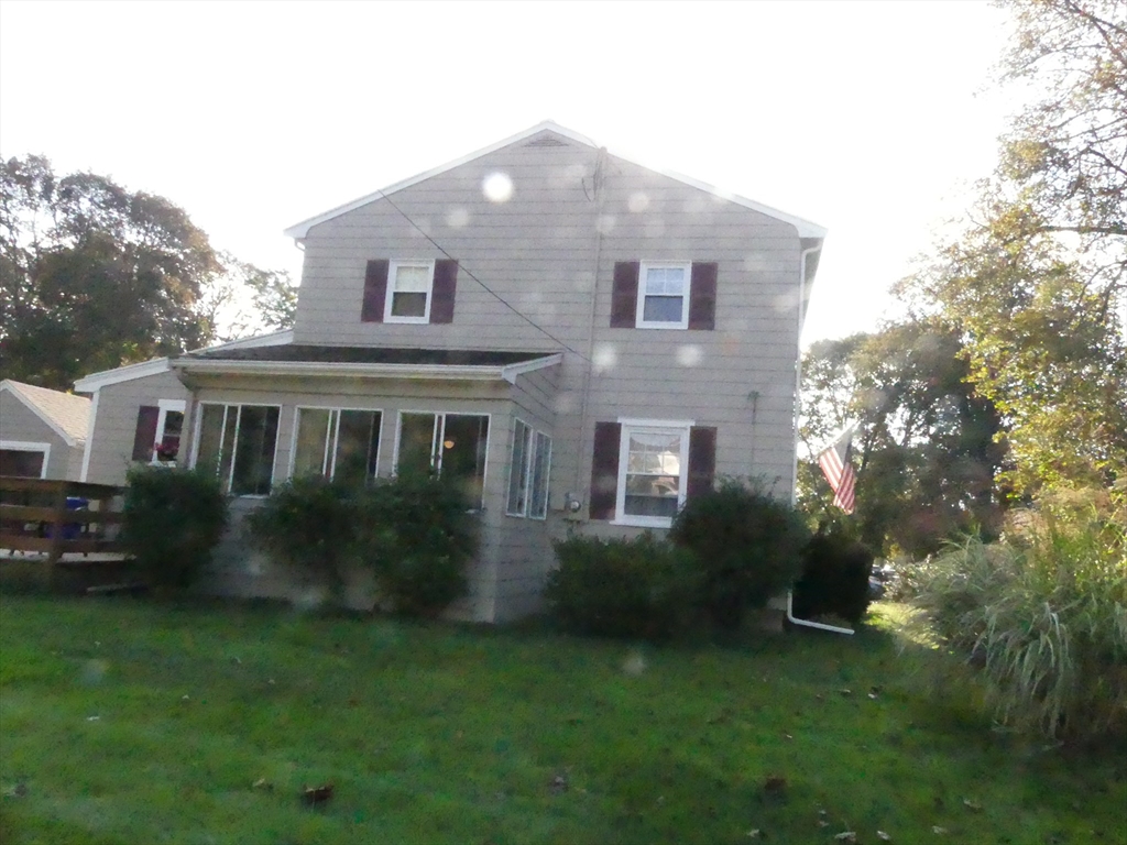 52 Ellsworth Avenue Beverly, MA 01915 - Photo 3 of 24 a front view of a house with a garden
