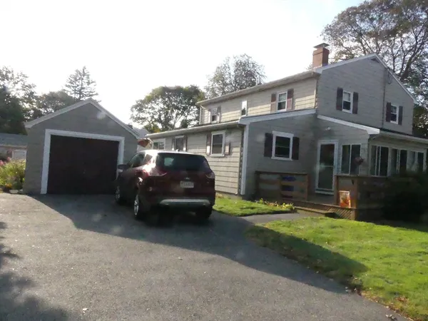 a car parked in front of a house