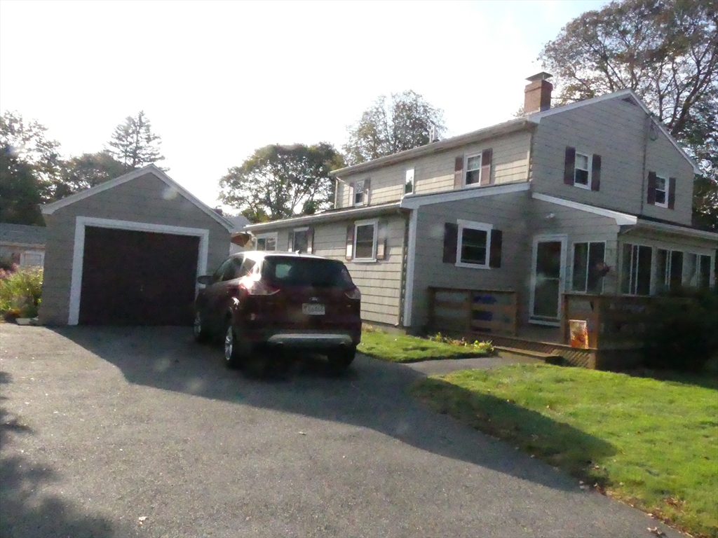 52 Ellsworth Avenue Beverly, MA 01915 - Photo 4 of 24 a car parked in front of a house