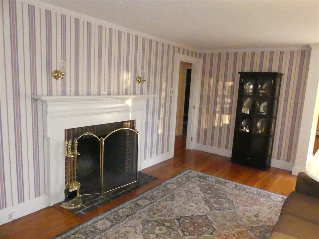 52 Ellsworth Avenue Beverly, MA 01915 - Photo 5 of 24 a view of a livingroom with entryway and wooden floor