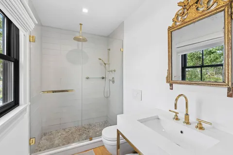 a bathroom with a sink and a shower