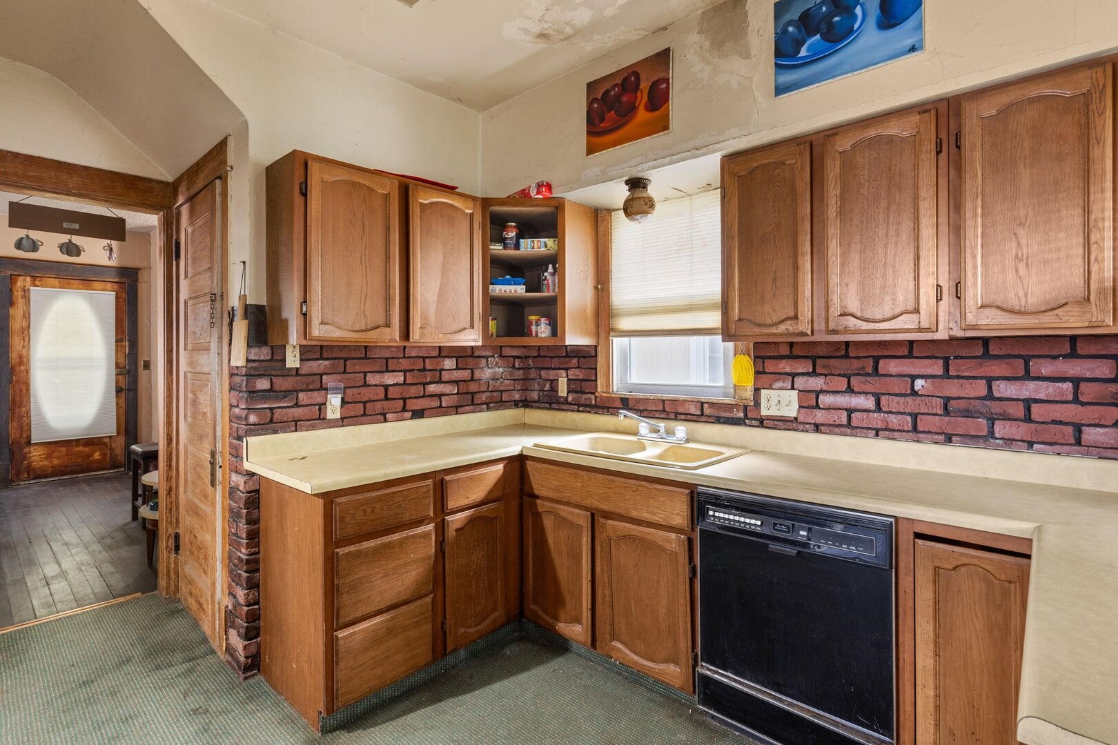 1721 28th Street Rock Island, IL 61201 - Photo 6 of 27 a kitchen with a sink stove and cabinets