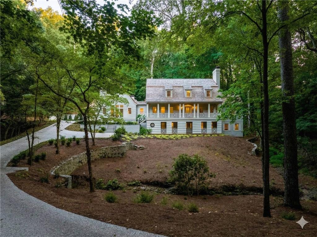 3990 Paces Ferry Road Northwest Atlanta, GA 30327 - Photo 2 of 63 a view of an house with backyard space and balcony