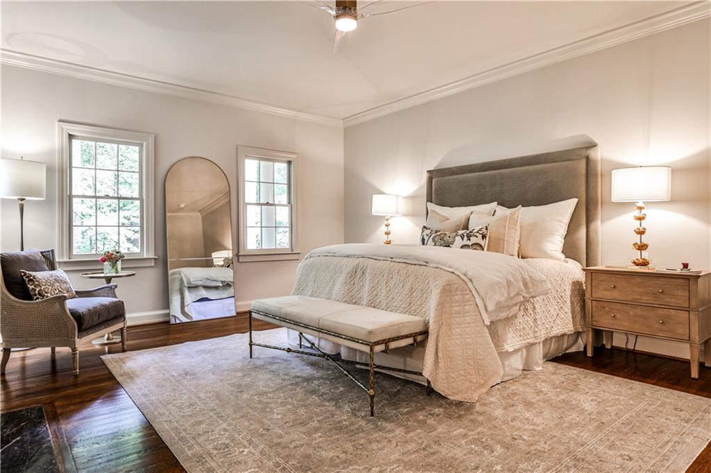 3990 Paces Ferry Road Northwest Atlanta, GA 30327 - Photo 24 of 63 a spacious bedroom with a bed a couch and dresser
