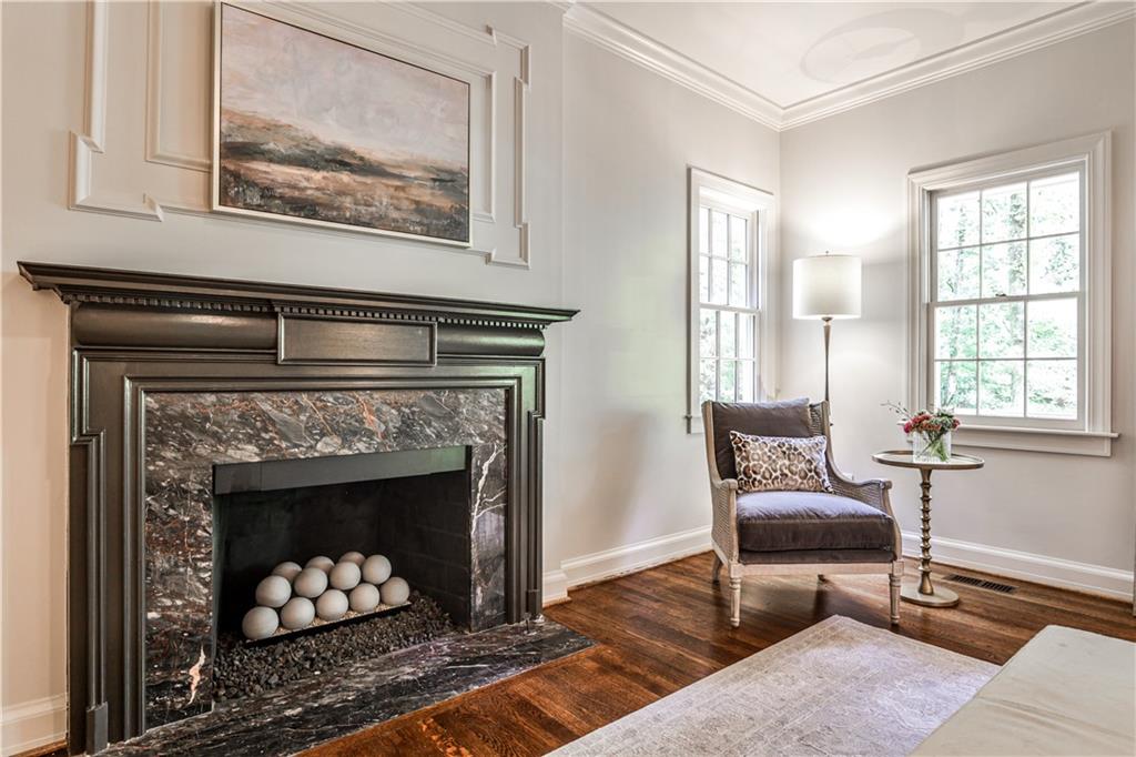 3990 Paces Ferry Road Northwest Atlanta, GA 30327 - Photo 25 of 63 a living room with furniture and a fireplace