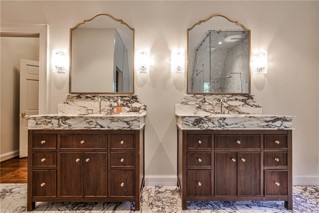 3990 Paces Ferry Road Northwest Atlanta, GA 30327 - Photo 27 of 63 a bathroom with a double vanity sink and a mirror
