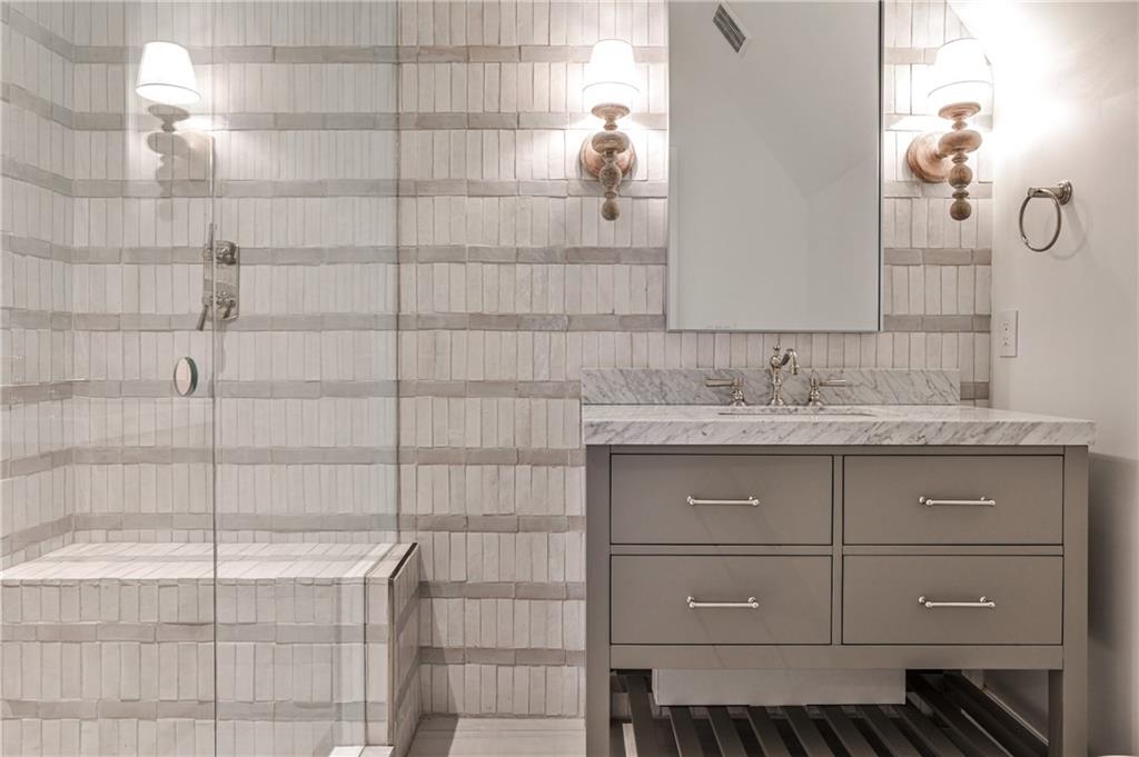 3990 Paces Ferry Road Northwest Atlanta, GA 30327 - Photo 35 of 63 a bathroom with a sink and a mirror