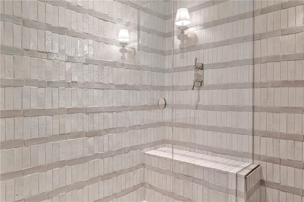 3990 Paces Ferry Road Northwest Atlanta, GA 30327 - Photo 36 of 63 a bathroom with a bathtub and shower
