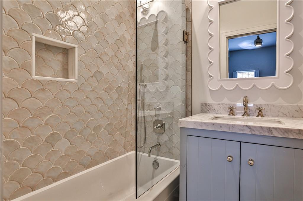 3990 Paces Ferry Road Northwest Atlanta, GA 30327 - Photo 37 of 63 a bathroom with a granite countertop sink a toilet and bathtub