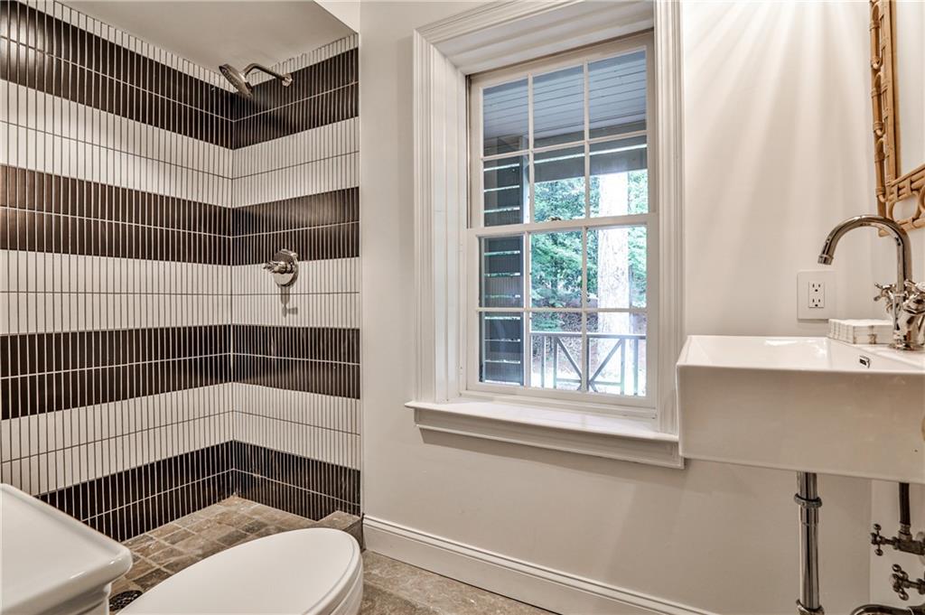 3990 Paces Ferry Road Northwest Atlanta, GA 30327 - Photo 48 of 63 a bathroom with a sink toilet and window