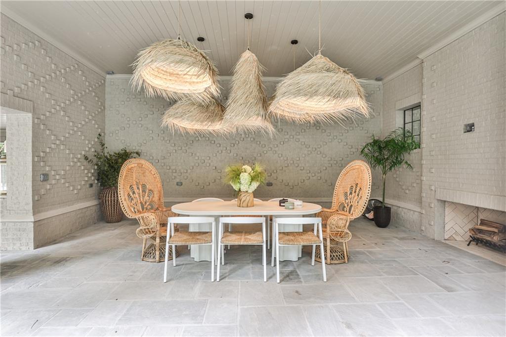 3990 Paces Ferry Road Northwest Atlanta, GA 30327 - Photo 52 of 63 a dining room with furniture and chandelier