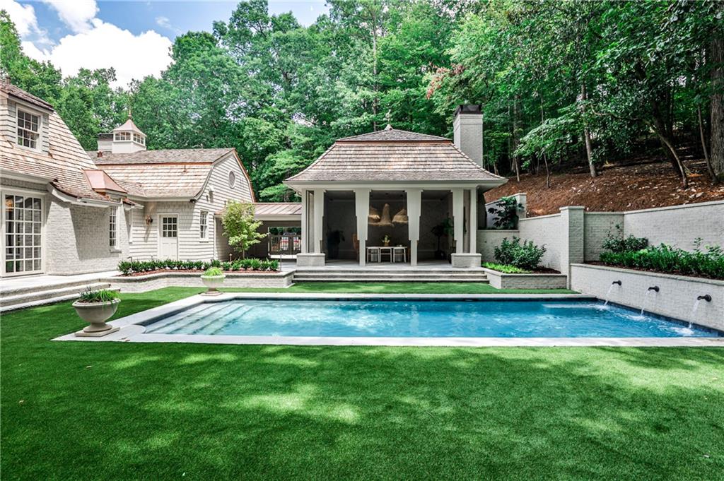 3990 Paces Ferry Road Northwest Atlanta, GA 30327 - Photo 55 of 63 a view of an house with backyard space and balcony