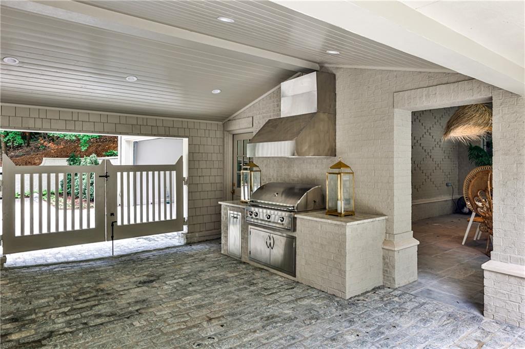 3990 Paces Ferry Road Northwest Atlanta, GA 30327 - Photo 59 of 63 a kitchen with a stove and a sink