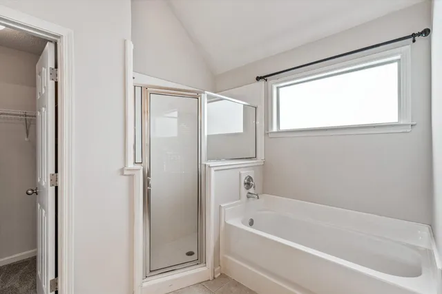 a view of bathroom with a tub sink and mirror
