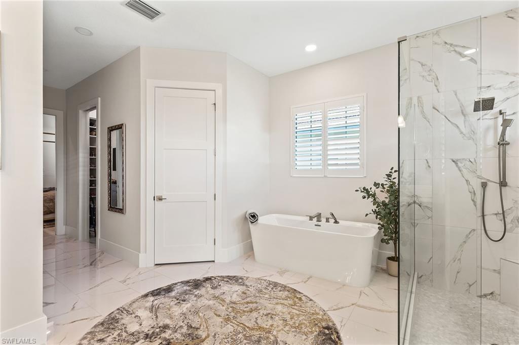 8829 Paradera Court Naples, FL 34112 - Photo 12 of 31 a bathroom with a sink toilet and shower