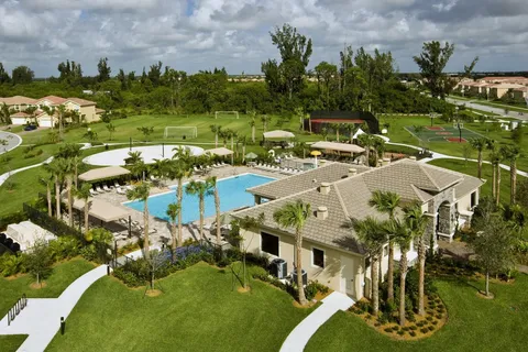 an aerial view of house with yard swimming pool and outdoor seating