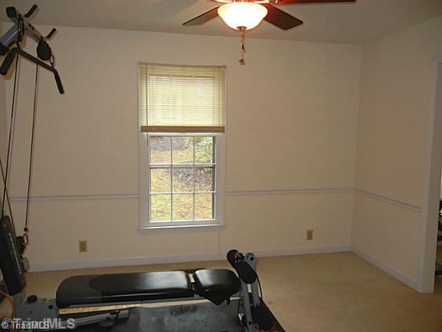 1411 Chesterfield Road Lewisville, NC 27023 - Photo 7 of 16 Dining Room. Formal dining room off the kitchen has a ceiling fan and is currently being used as a work out room.