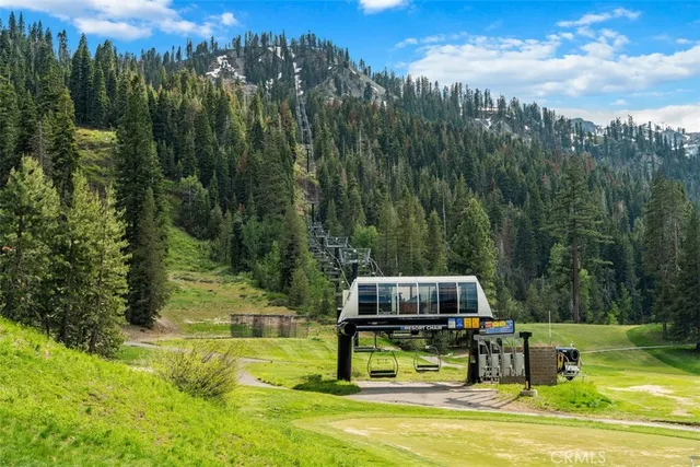 a view of a swimming pool with a yard