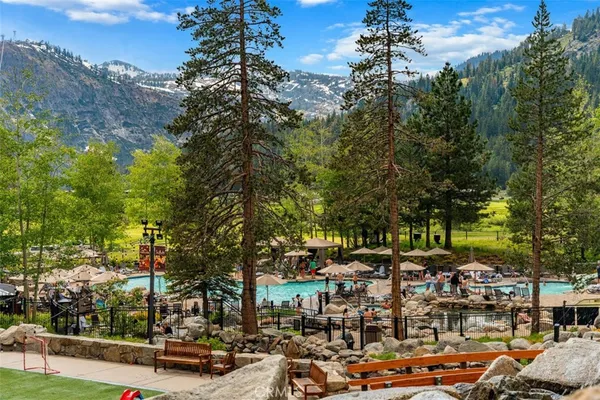 a view of a swimming pool with a lawn chairs