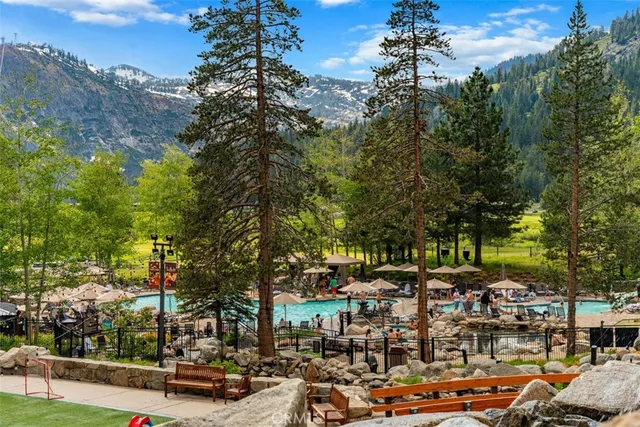 a view of a swimming pool with a lawn chairs