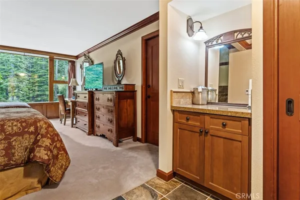 a bedroom with a bed and furniture