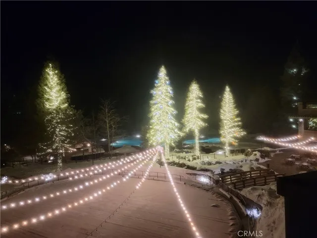 a view of a yard with a house and wooden fence
