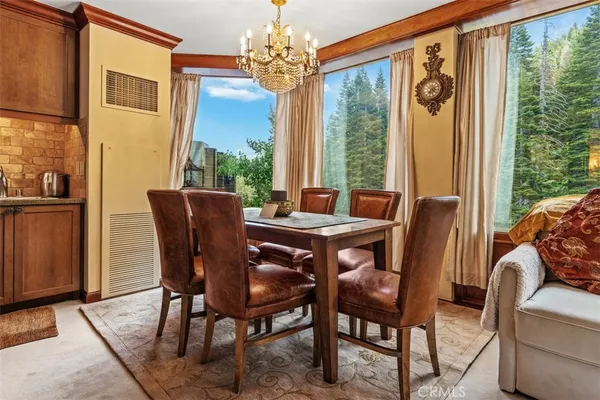 a view of a dining room with furniture window and outside view