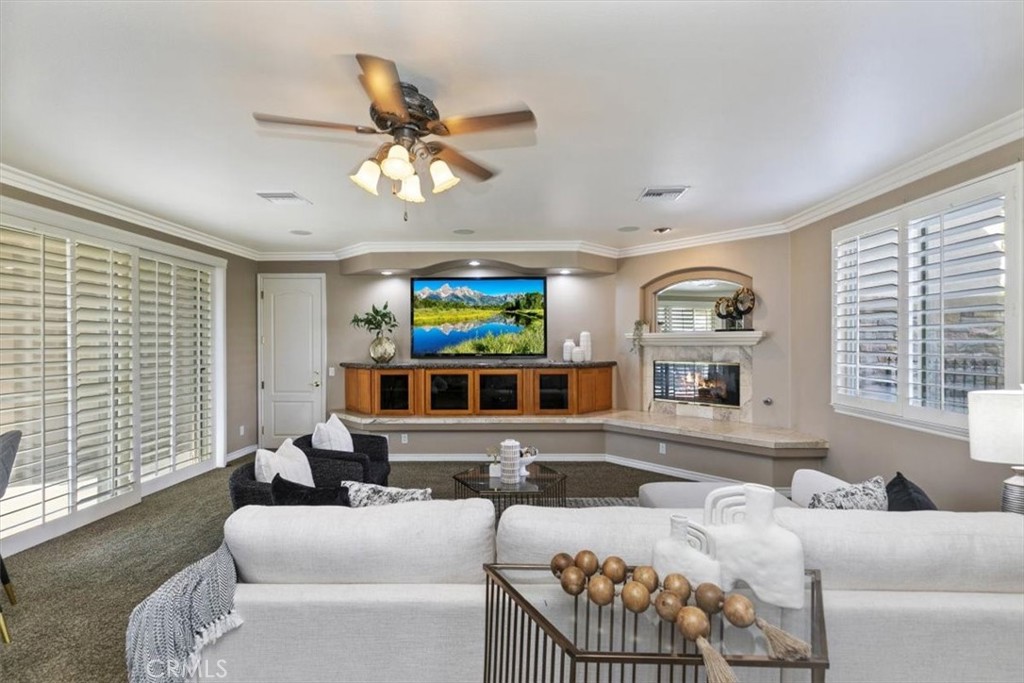 5030 Calypso Court Rancho Cucamonga, CA 91737 - Photo 29 of 74 a living room with furniture and a large window