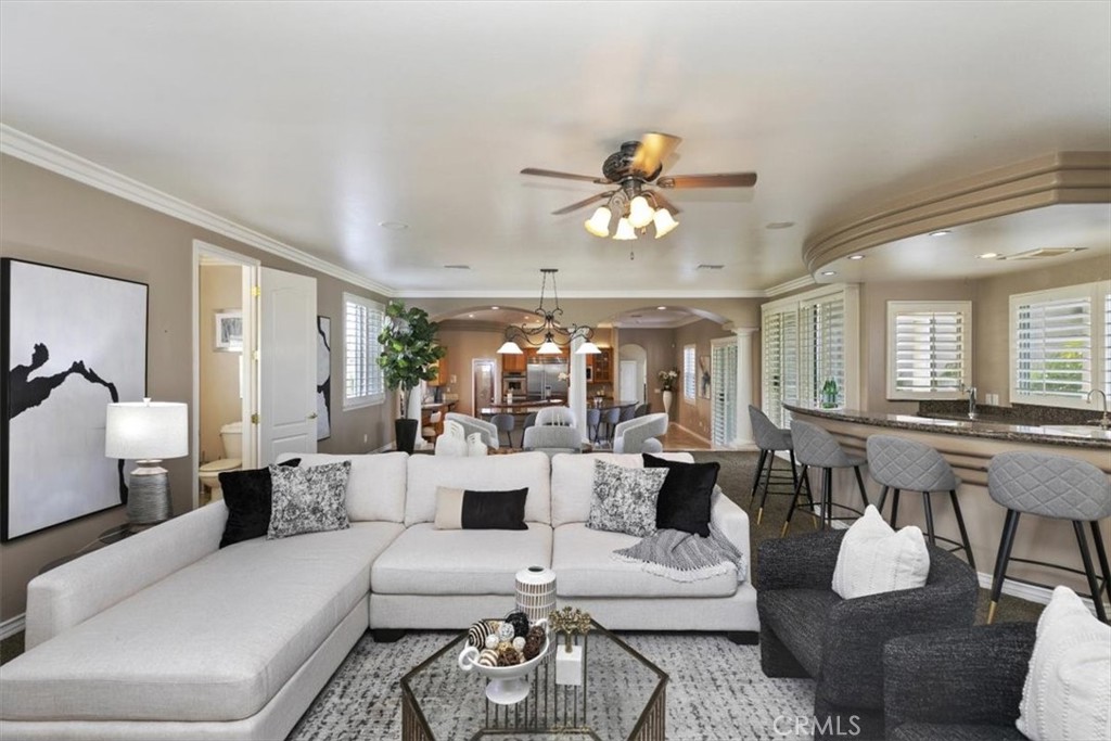 5030 Calypso Court Rancho Cucamonga, CA 91737 - Photo 31 of 74 a living room with furniture and a large window