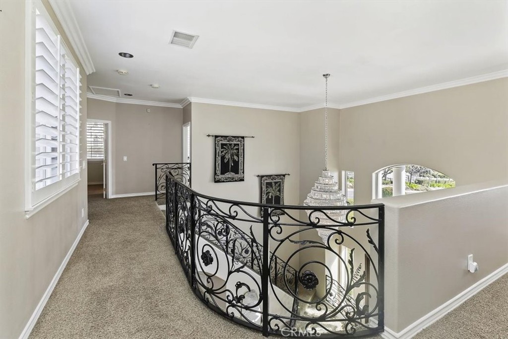 5030 Calypso Court Rancho Cucamonga, CA 91737 - Photo 34 of 74 a view of a hallway with washer and dryer