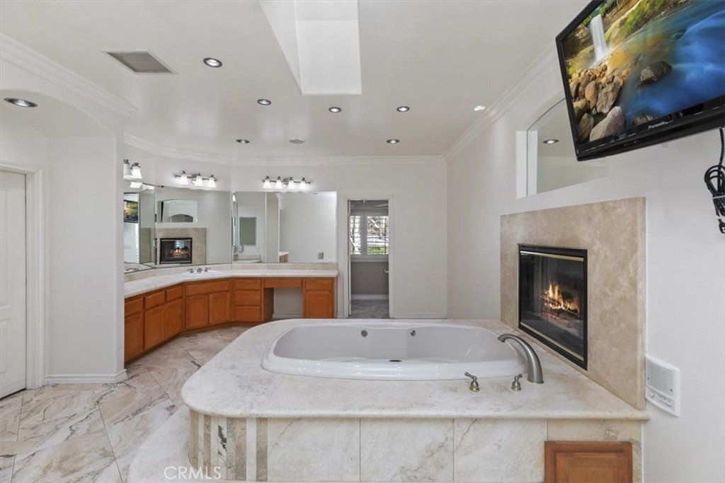 5030 Calypso Court Rancho Cucamonga, CA 91737 - Photo 39 of 74 a large white kitchen with a large island