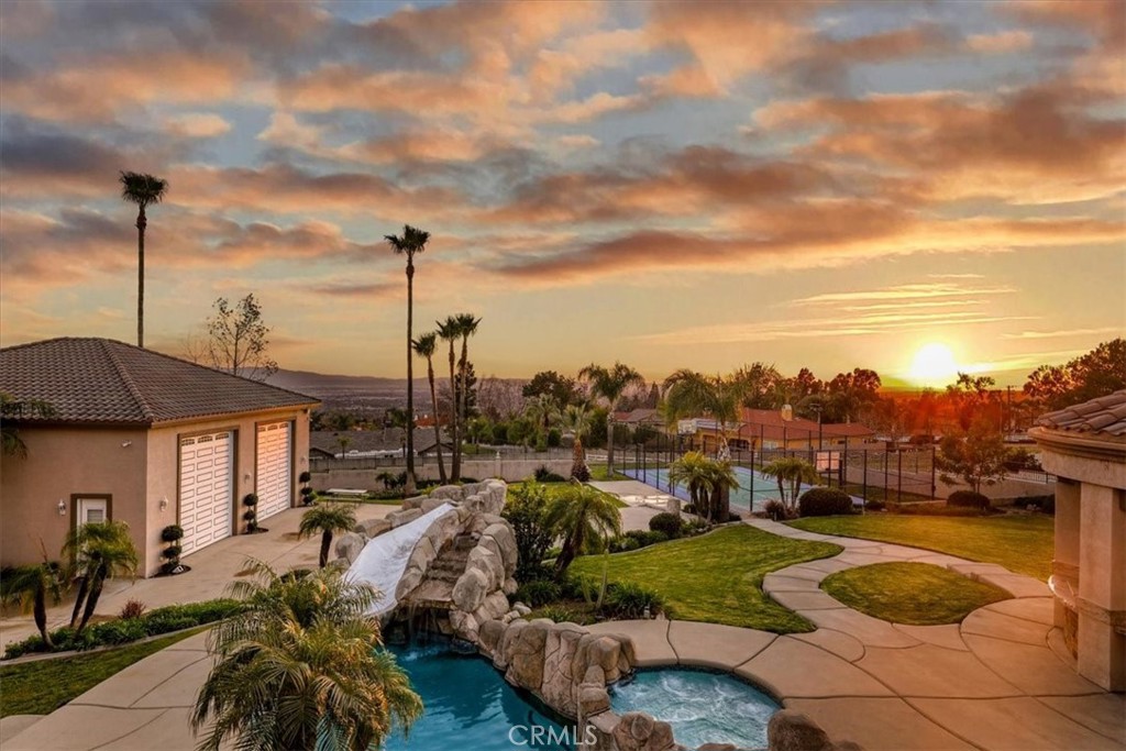 5030 Calypso Court Rancho Cucamonga, CA 91737 - Photo 43 of 74 a view of a swimming pool and outside seating area