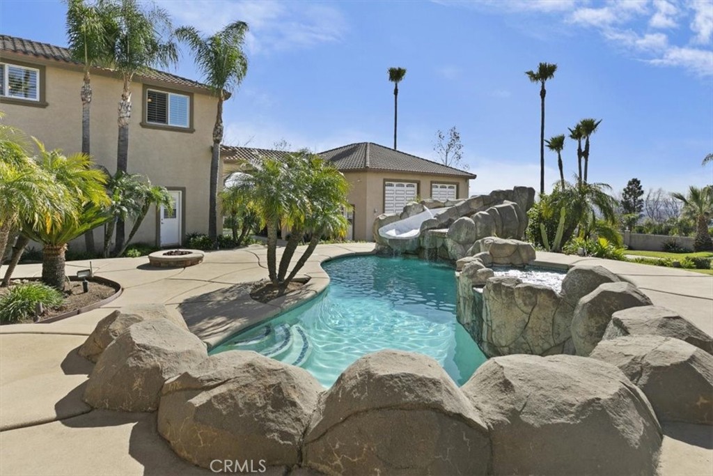5030 Calypso Court Rancho Cucamonga, CA 91737 - Photo 48 of 74 a view of a house with a patio