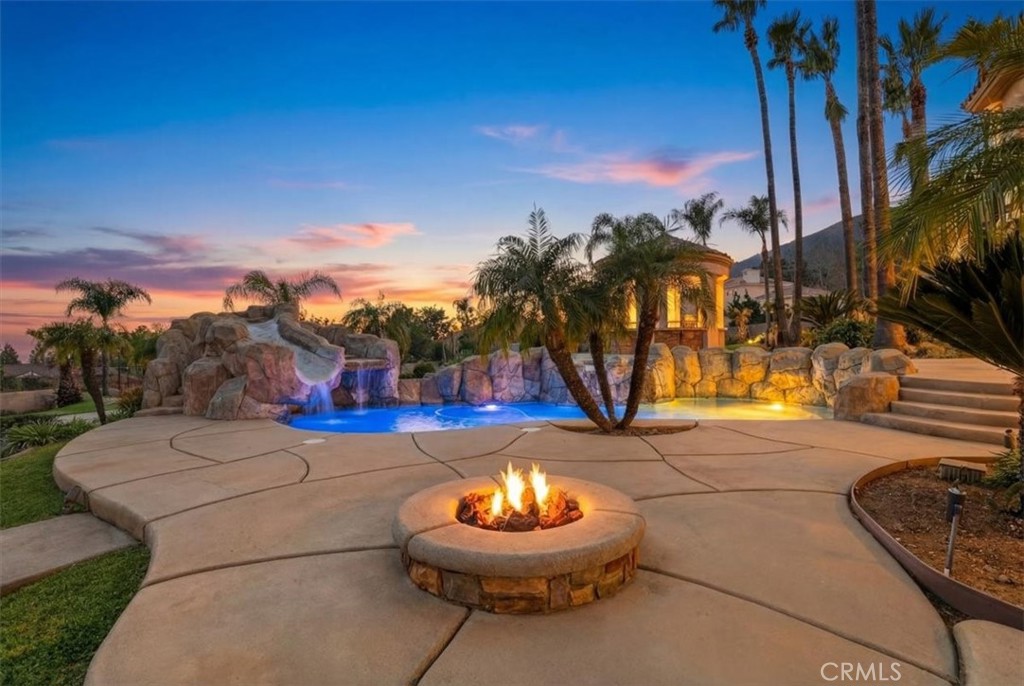 5030 Calypso Court Rancho Cucamonga, CA 91737 - Photo 49 of 74 a view of a street with a fire pit and a fire pit