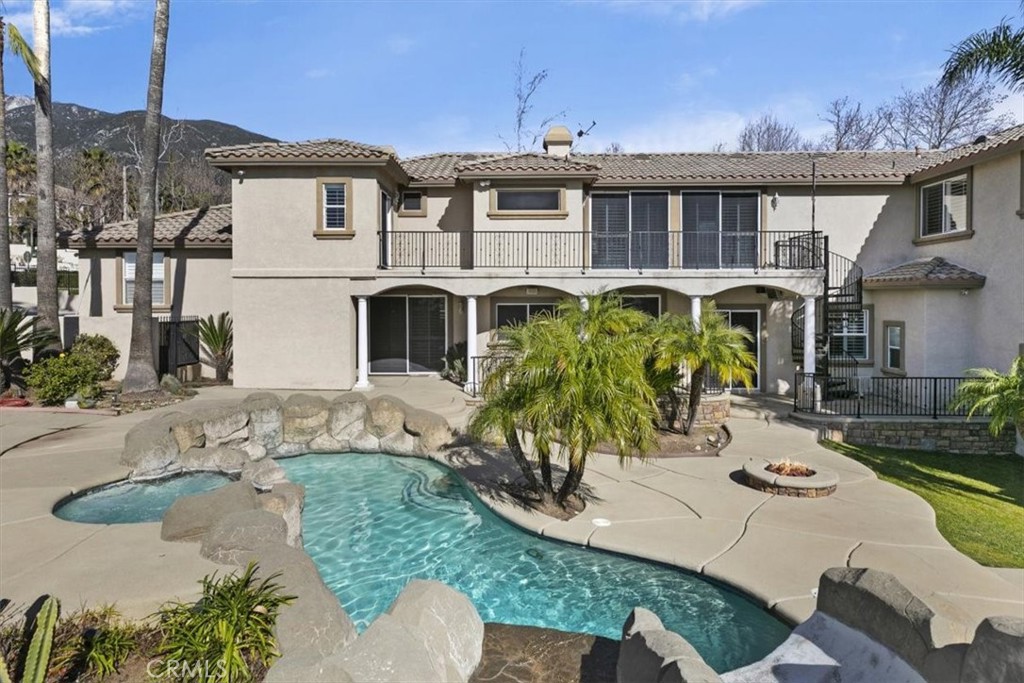 5030 Calypso Court Rancho Cucamonga, CA 91737 - Photo 52 of 74 a view of a white house with a chairs in patio