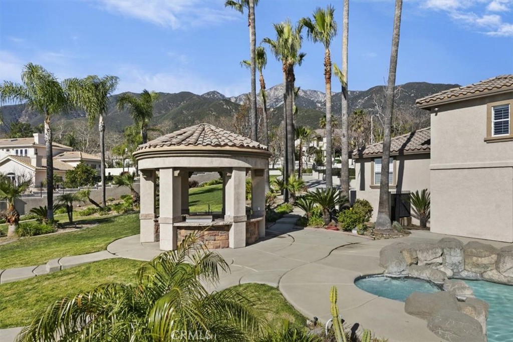 5030 Calypso Court Rancho Cucamonga, CA 91737 - Photo 55 of 74 a front view of a house with a yard
