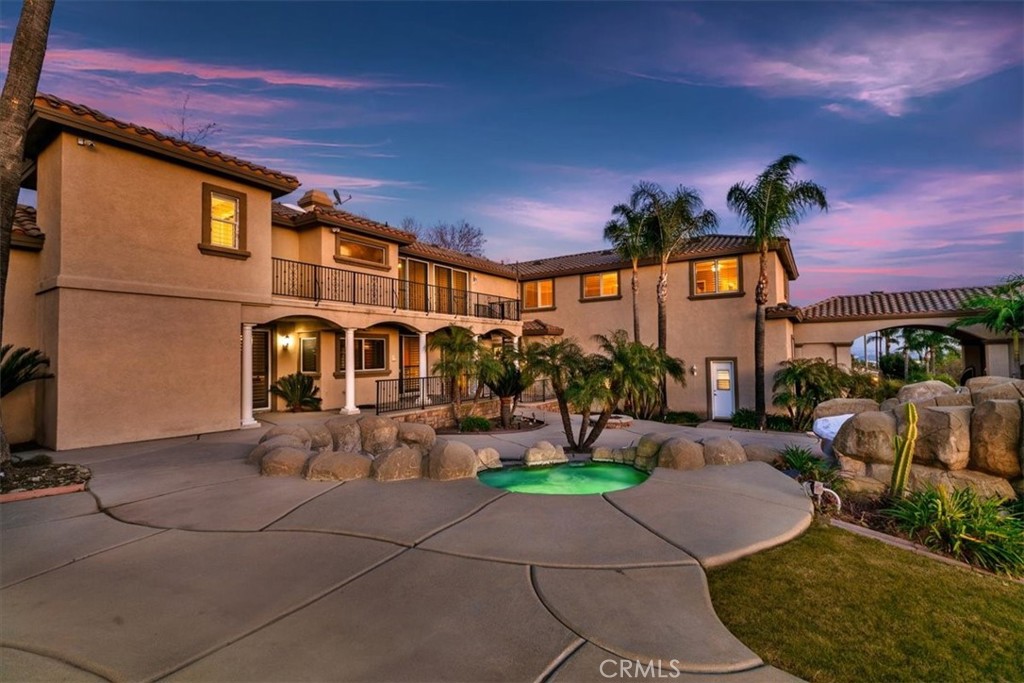 5030 Calypso Court Rancho Cucamonga, CA 91737 - Photo 60 of 74 a front view of a house with garden