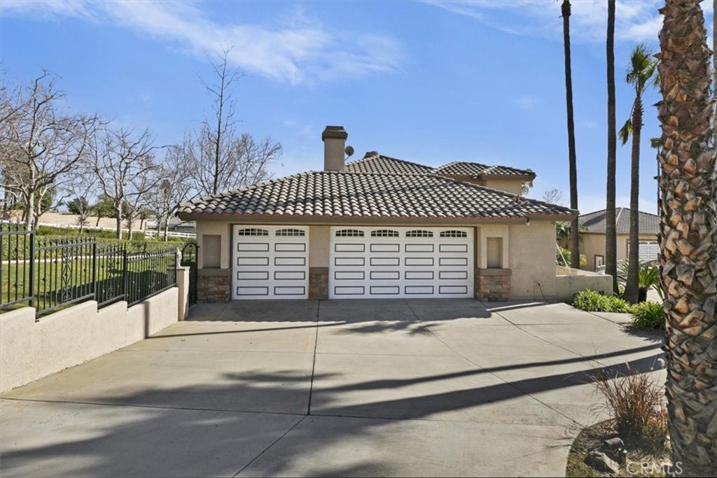 5030 Calypso Court Rancho Cucamonga, CA 91737 - Photo 64 of 74 a front view of a house with a garage
