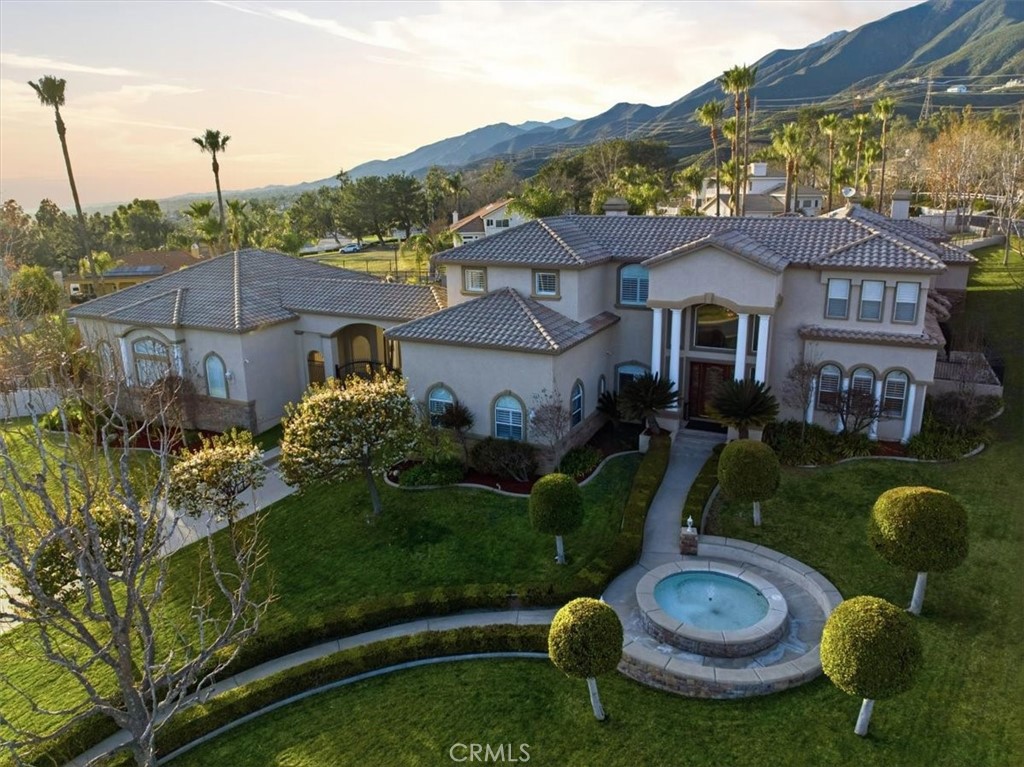 5030 Calypso Court Rancho Cucamonga, CA 91737 - Photo 70 of 74 a view of a house with a yard and a garden