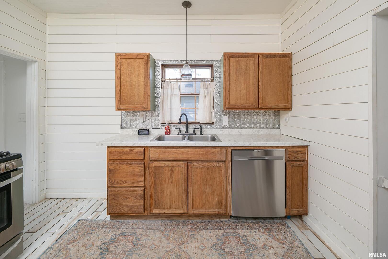 401 3rd Street Matherville, IL 61263 - Photo 14 of 32 a bathroom with a sink and a mirror