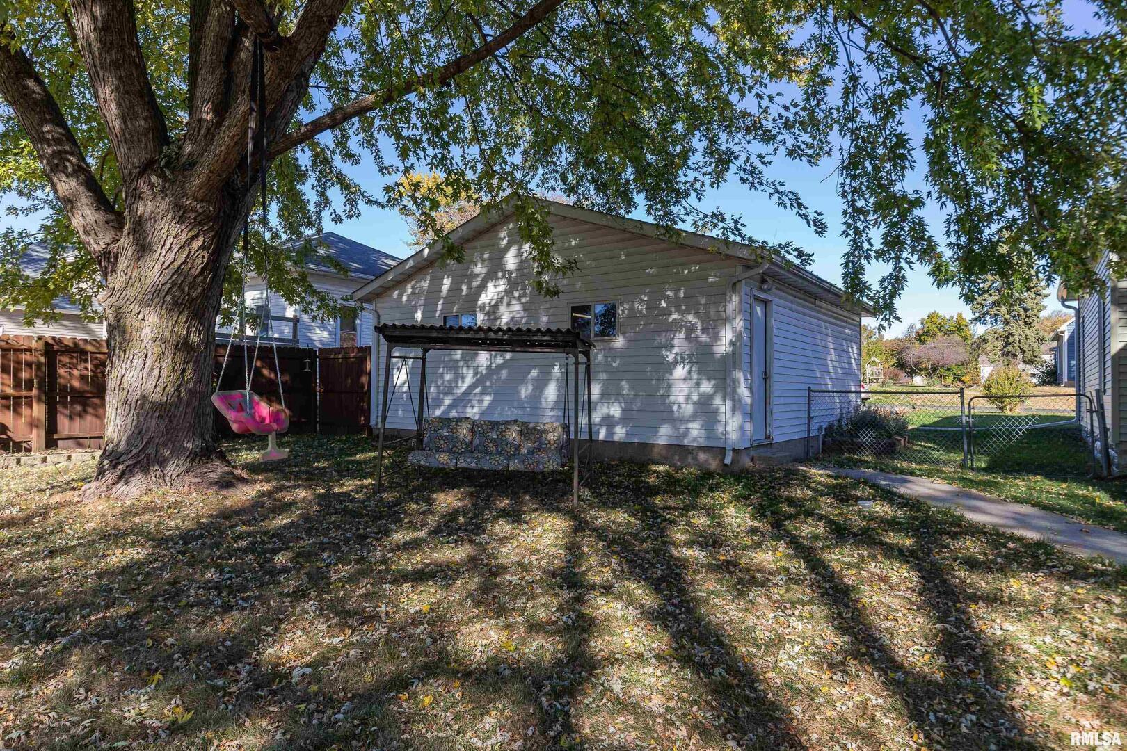 401 3rd Street Matherville, IL 61263 - Photo 29 of 32 a view of a barn in the middle of a yard