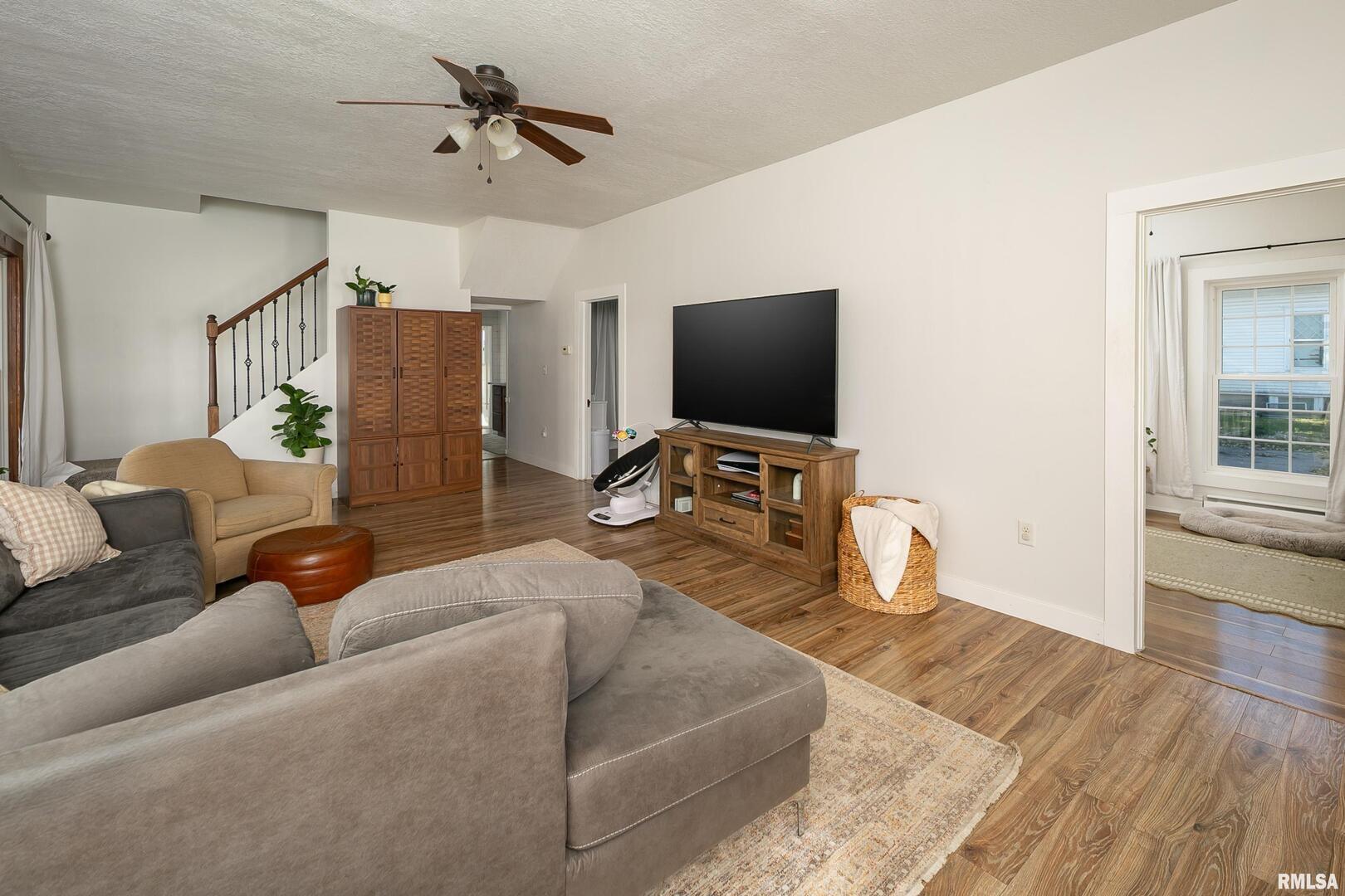 401 3rd Street Matherville, IL 61263 - Photo 5 of 32 a living room with furniture and a flat screen tv