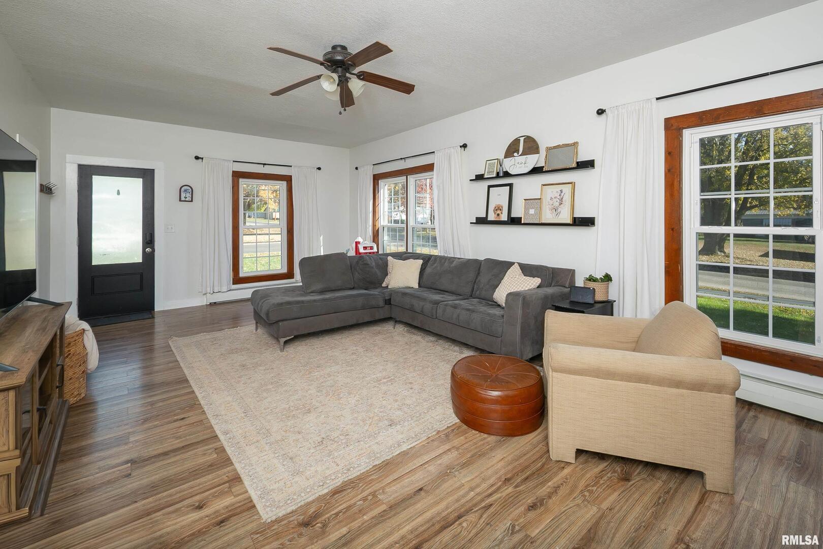 401 3rd Street Matherville, IL 61263 - Photo 6 of 32 a living room with furniture and a large window