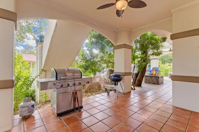 a view of a dining table and chairs in a patio
