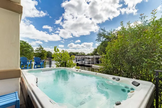 a view of a swimming pool with outdoor seating