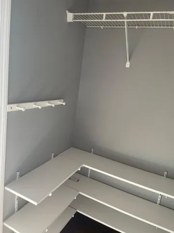 a view of a room with racks on the wall