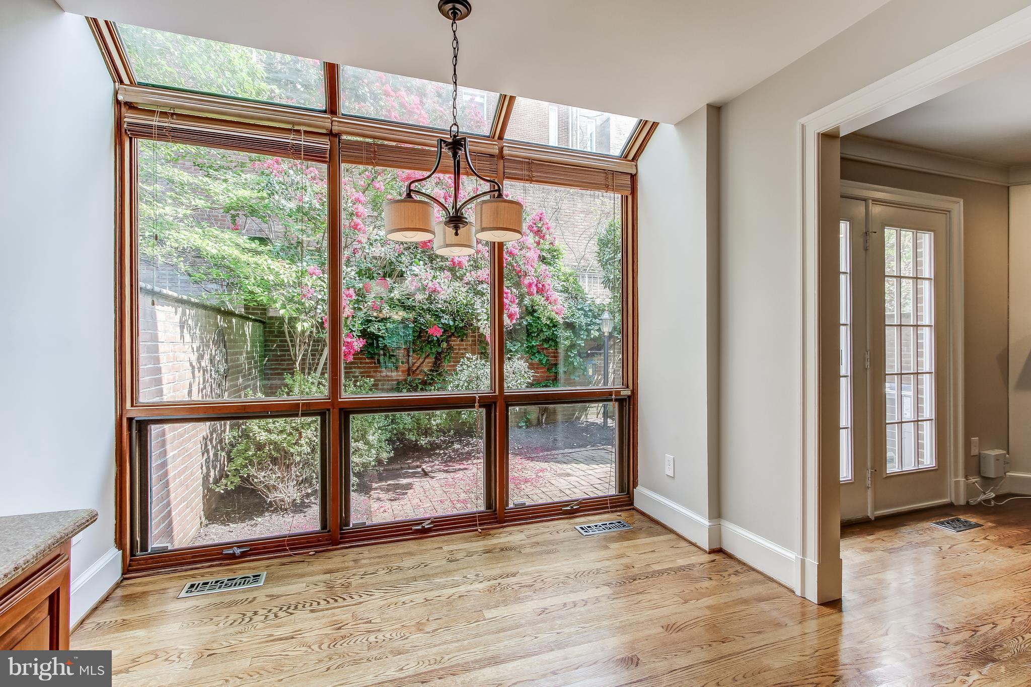 8053 Rising Ridge Road Bethesda, MD 20817 - Photo 14 of 30 a view of an empty room with wooden floor and windows